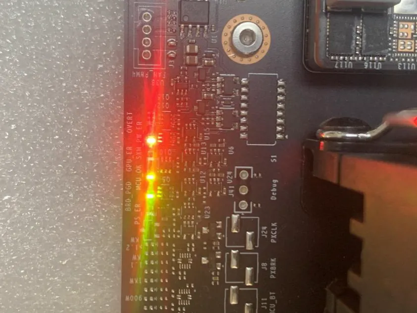 GPU board under diagnostic testing with LED indicators